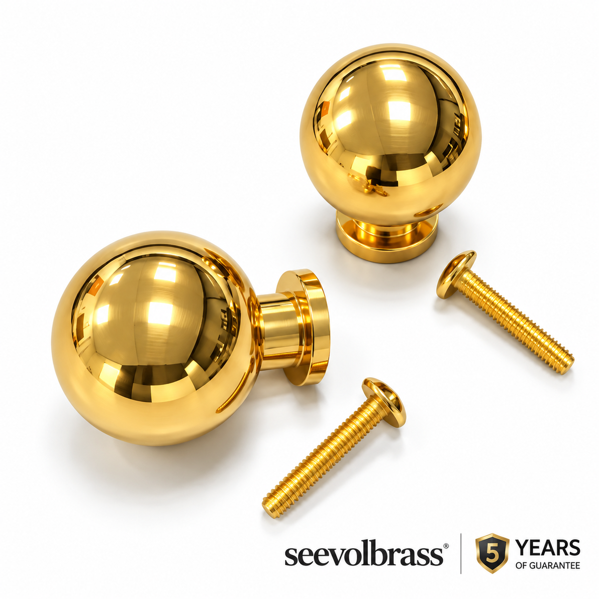 Two polished unlacquered brass ball cabinet knobs with two mounting screws on white and a 5-year guarantee label