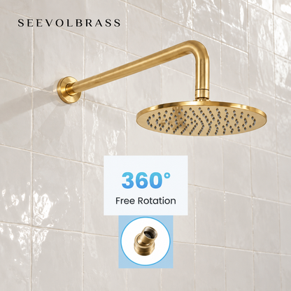 Eden unlacquered brass rainfall shower head with wall arm and inset highlighting its 360-degree swivel connector