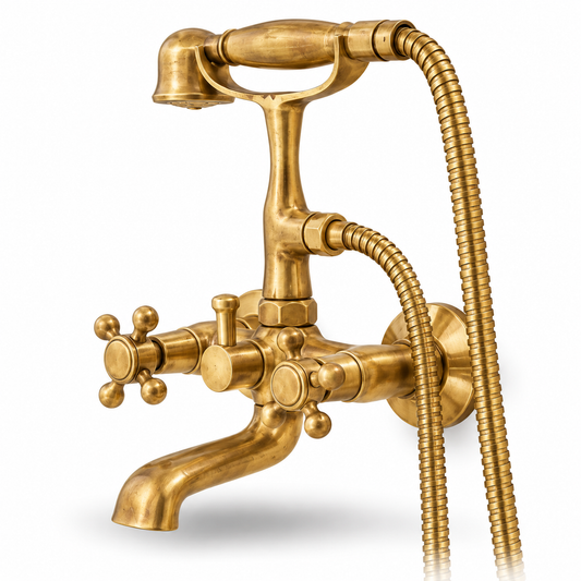 Unlacquered brass wall-mount telephone tub filler with cross handles and handheld shower, angled view on white