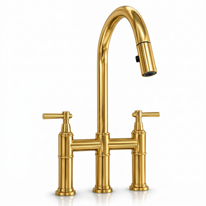 Unlacquered brass pull-down bridge kitchen faucet with a high-arc spout and twin lever handles on a white background