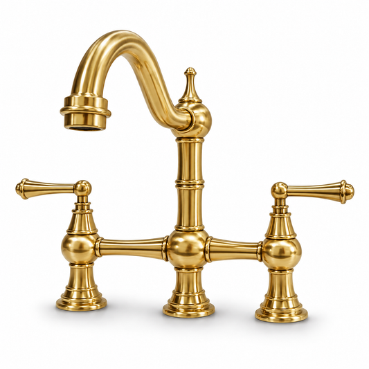 Unlacquered brass bridge kitchen faucet with twin lever handles and a curved spout on a white background